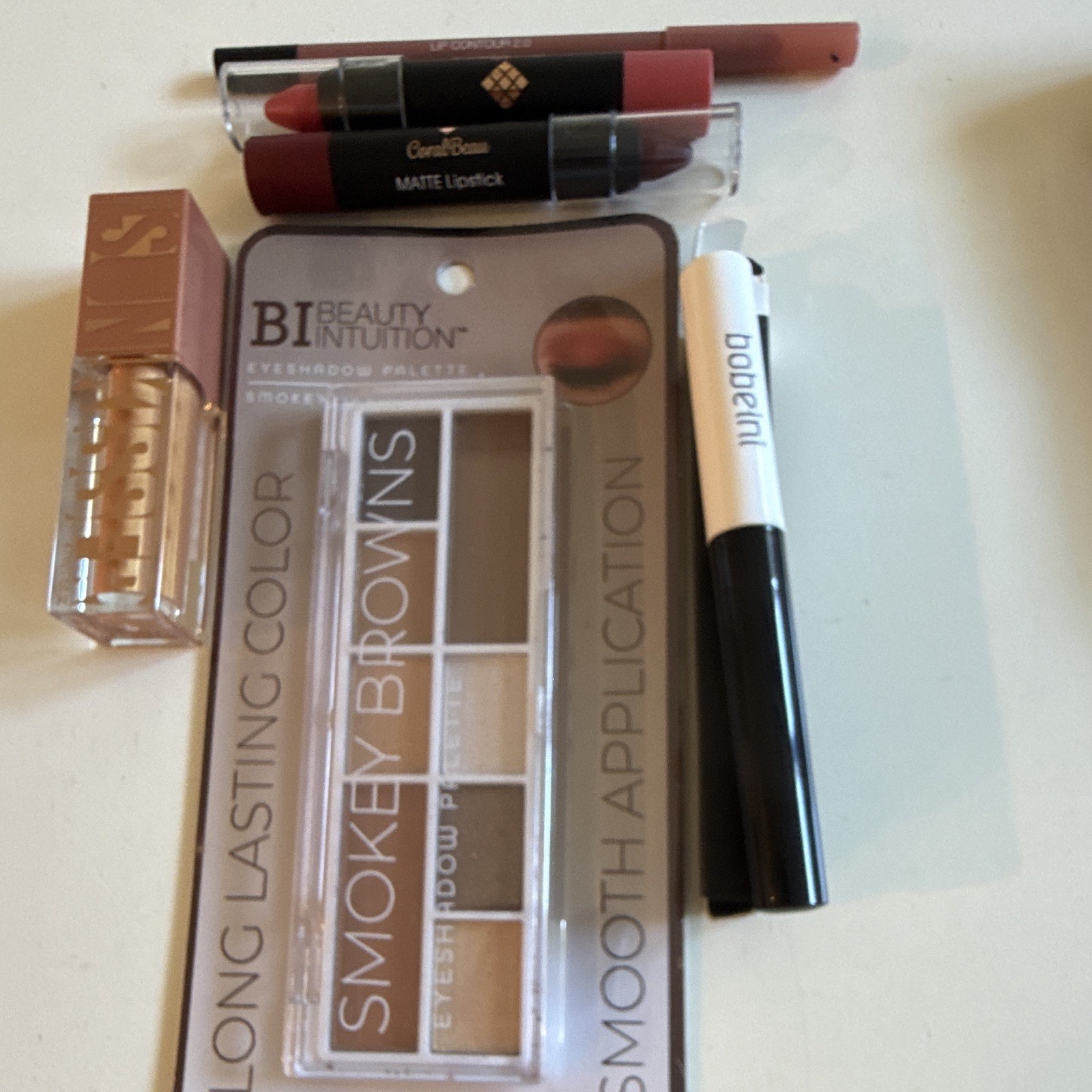 Assorted Beauty Intuition Smokey Browns Palette coral beau matte lipstick
