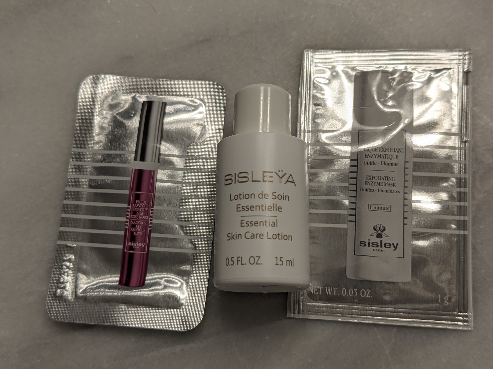 QTY 9 Sisley sample set, L’Integral Anti-age , serum & Winter 2025 make up bag