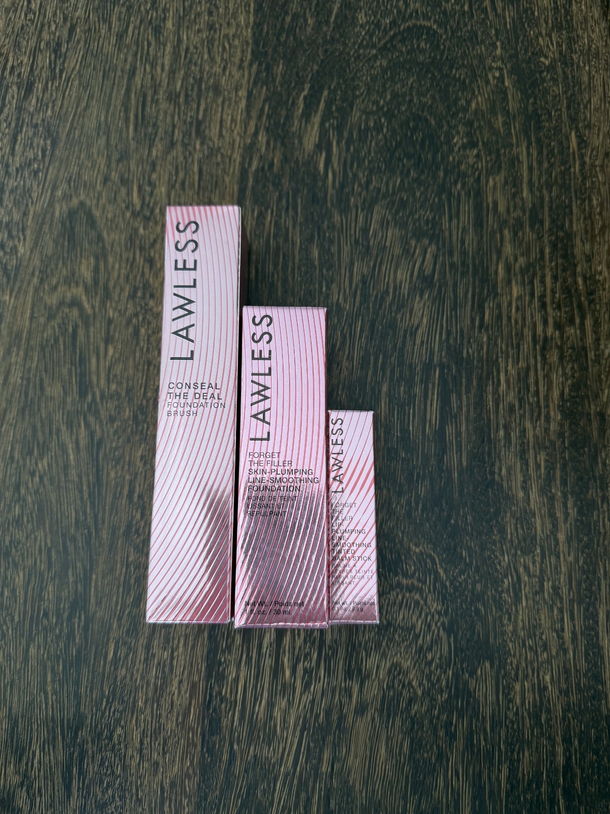 LAWLESS LOT OF 3, SKIN PLUMPING FOUNDATION, FOUNDATION BRUSH, TINTED BALM $100