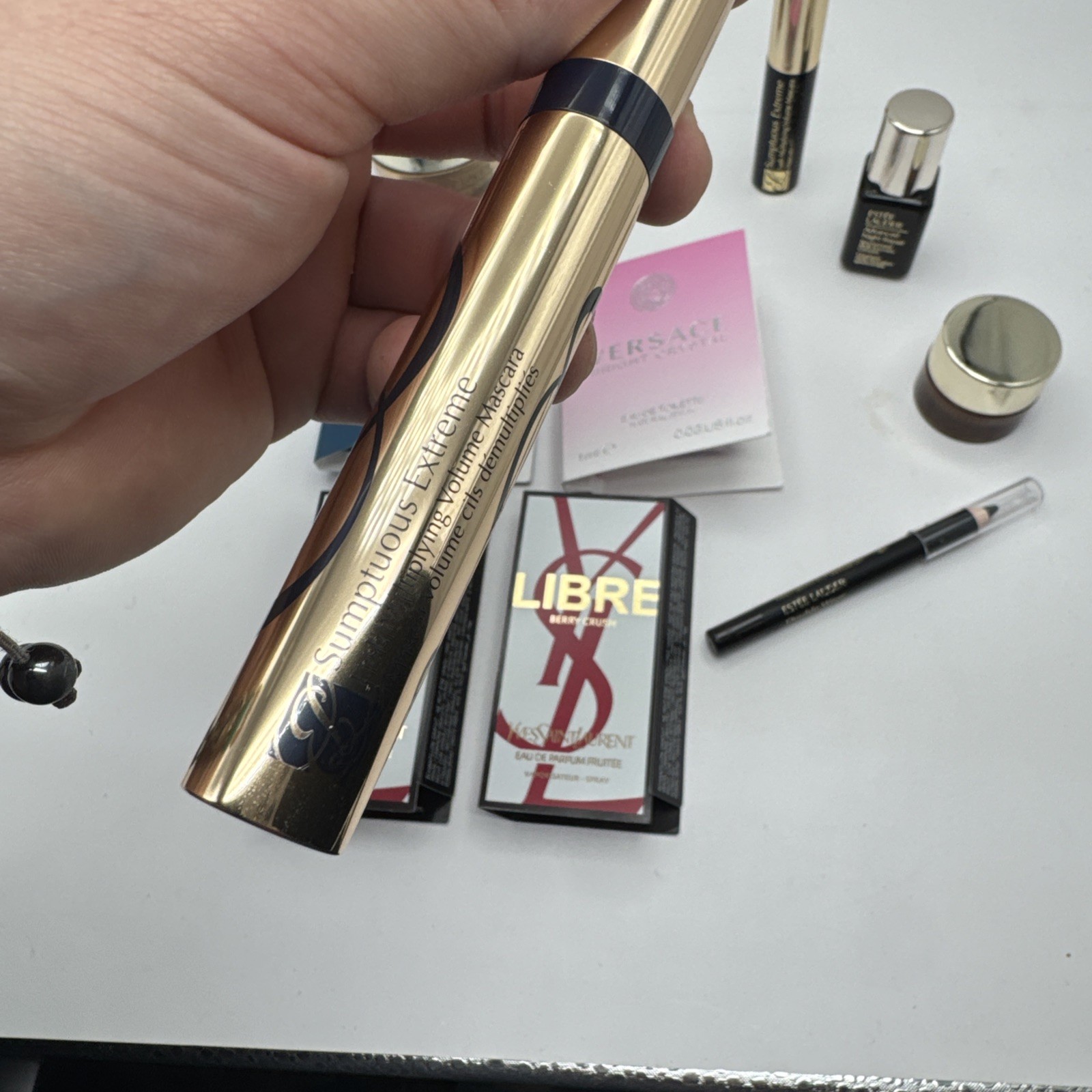 Lot of 10 Assorted Beauty Items/perfume (YSL, Versace, Estēe Lauder)
