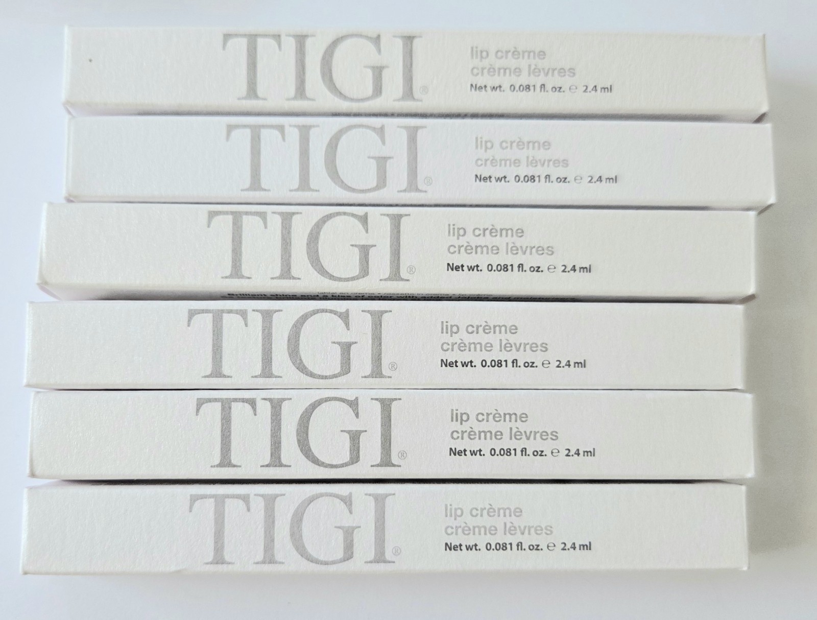 LOT OF 85 TIGI COSMETICS, LIPSTICK, LIPLINER, BLUSH, EYESHADOW, BRUSHES, NIB