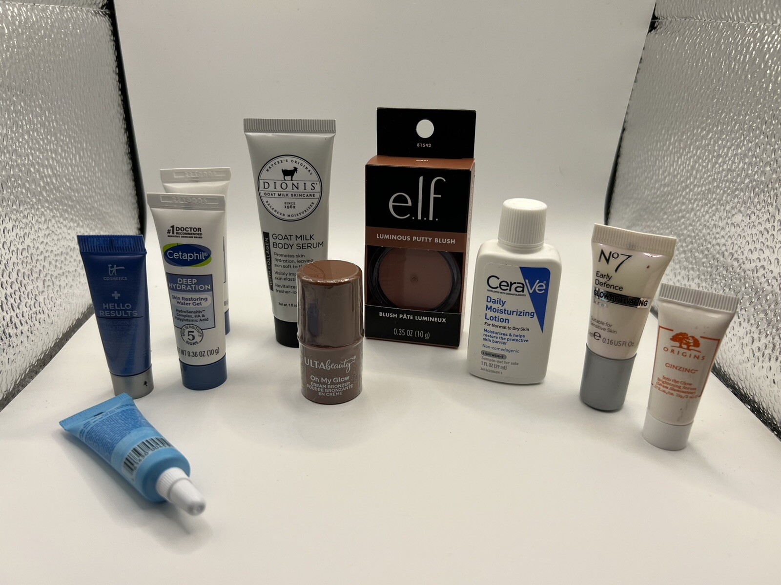 10 pieces make up and skincare travel sizes. Cerave, Origins, Elf, Its Cosmetics