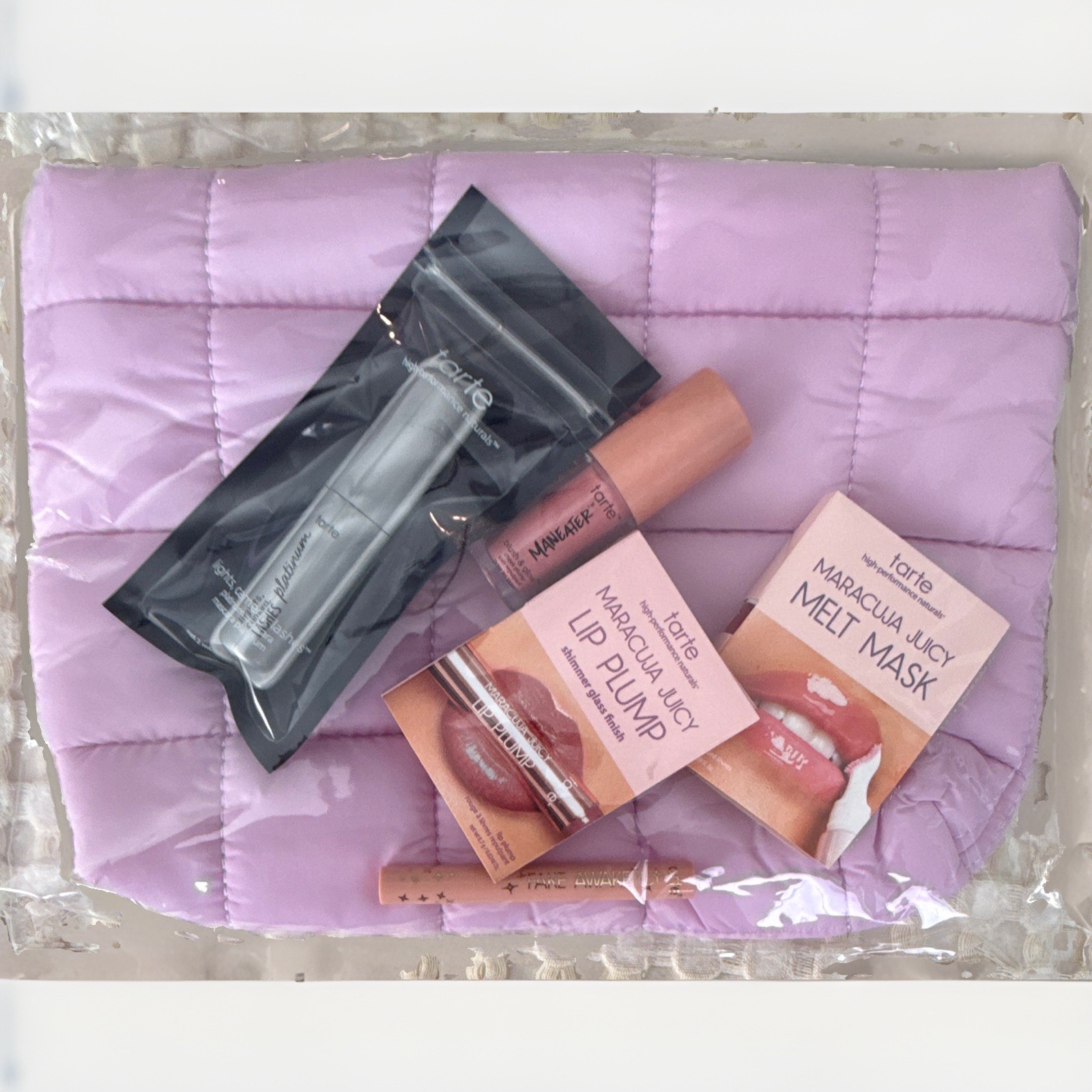 tarte Travel Bag + Maracuja Juicy Lip Plump, Melt Mask, Mascara, Eyliner & Blush