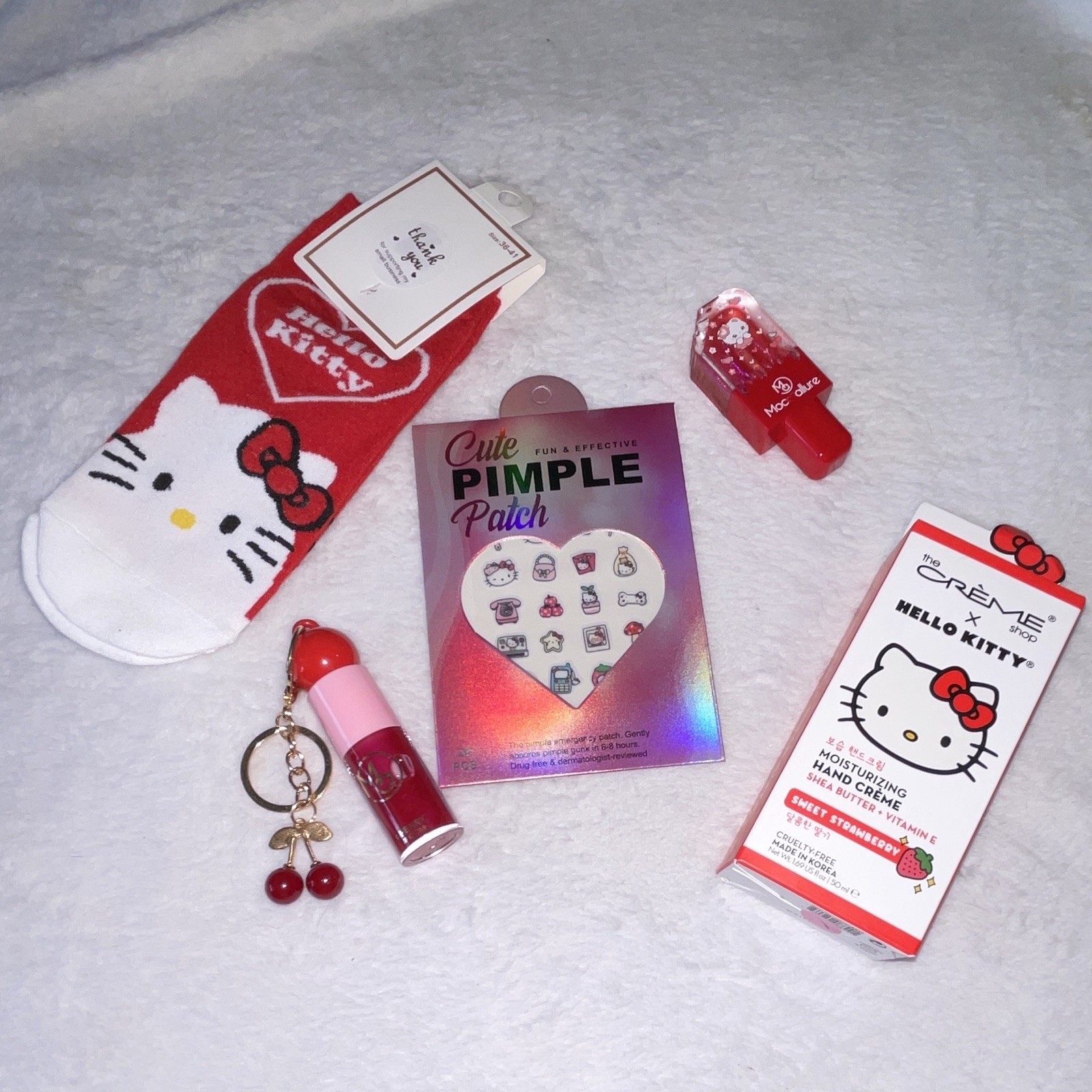 Assorted Hello Kitty The Crème Shop Lot: Hand Creme, Pimple Patches, Lip Gloss