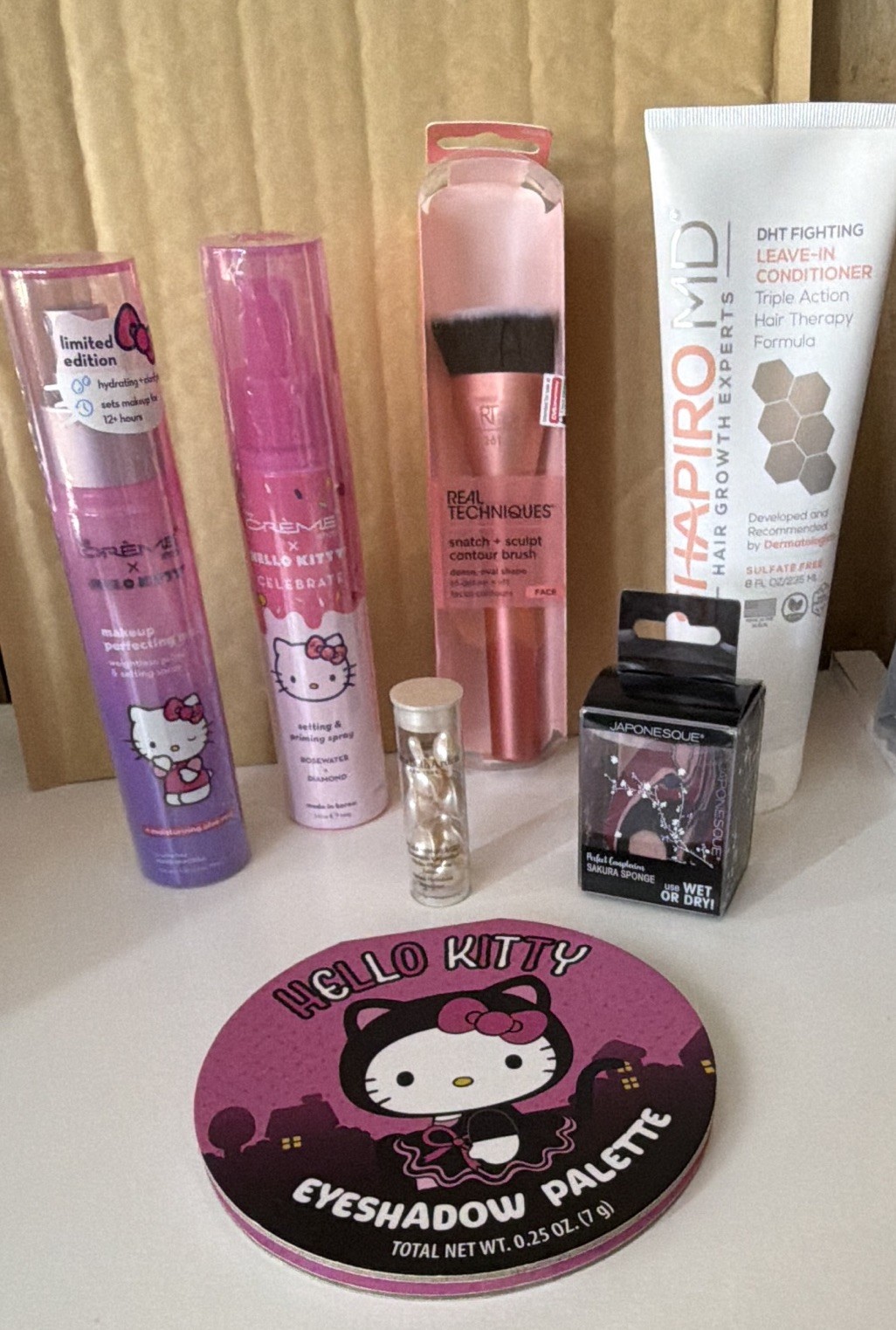 Assorted Makeup & Beauty Lot: Hello Kitty Palette, Brush, Hair Growth Therapy