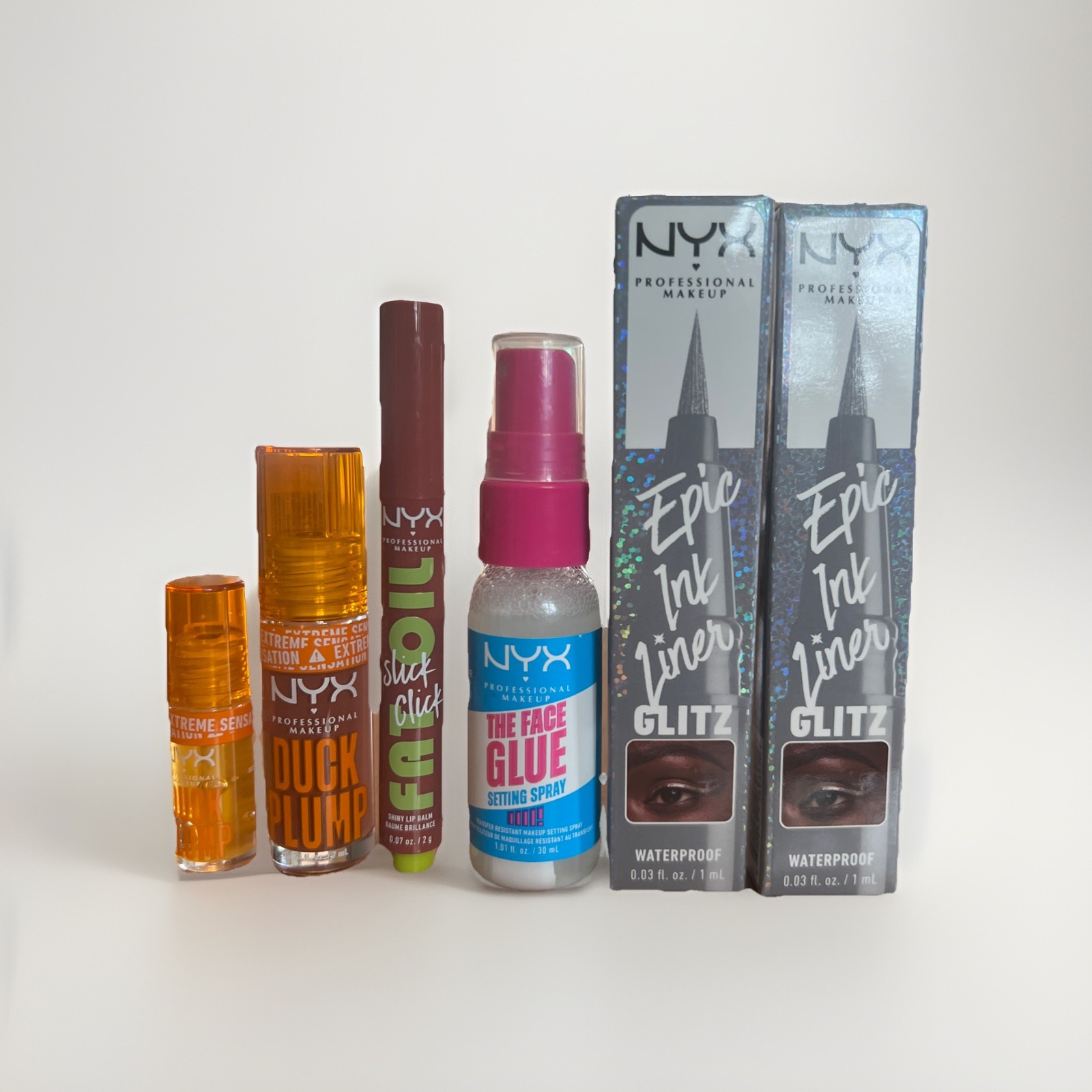 Lot of 6 NYX Makeup: 2 Plumping Gloss, 1 Lip Balm, 1 Setting Spray, 2 Eyeliners