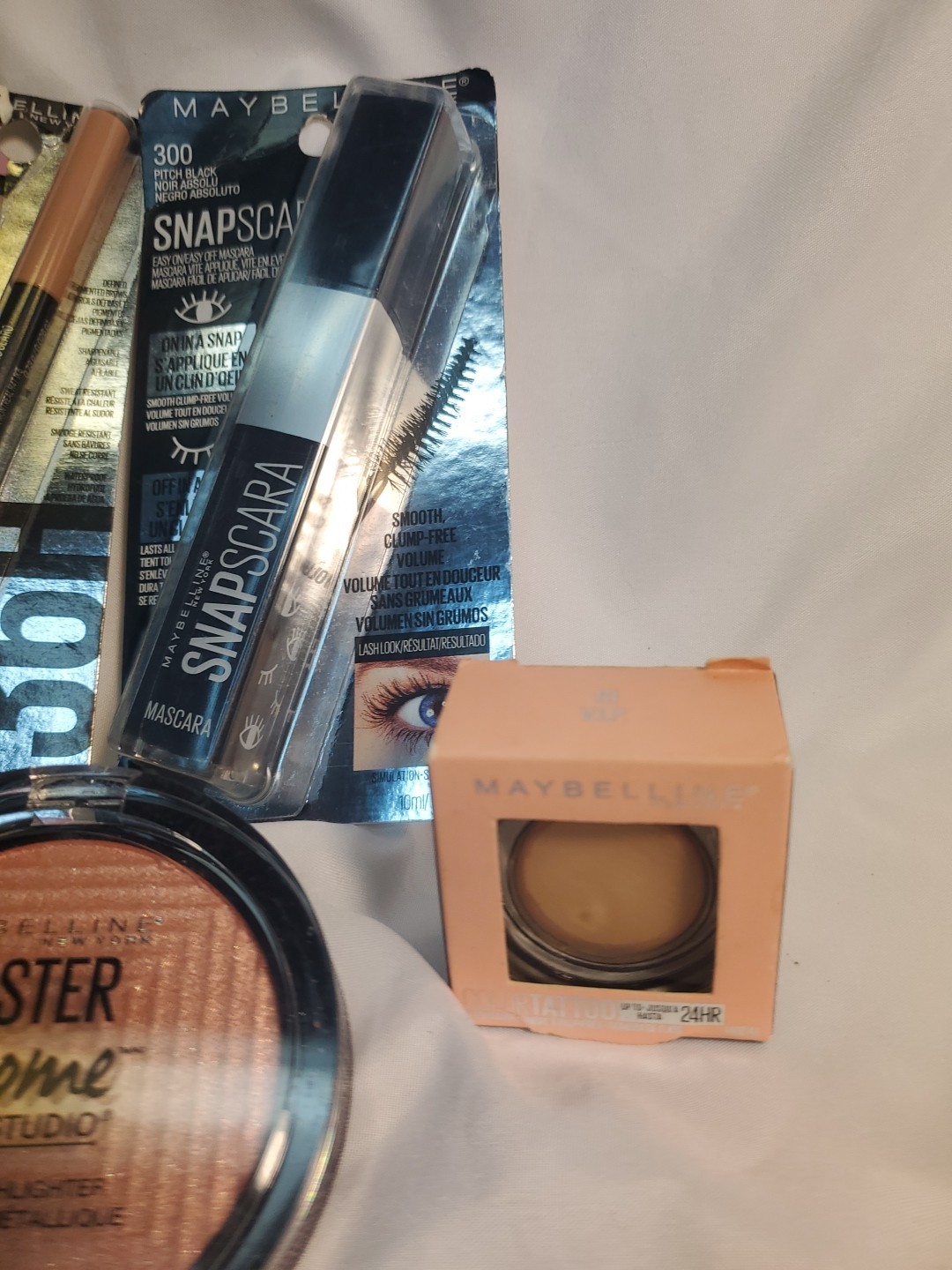 4pc. Maybelline Highlighter, Mascara,Tatoo Studio Brow Pencil, Cream Eyeshadow