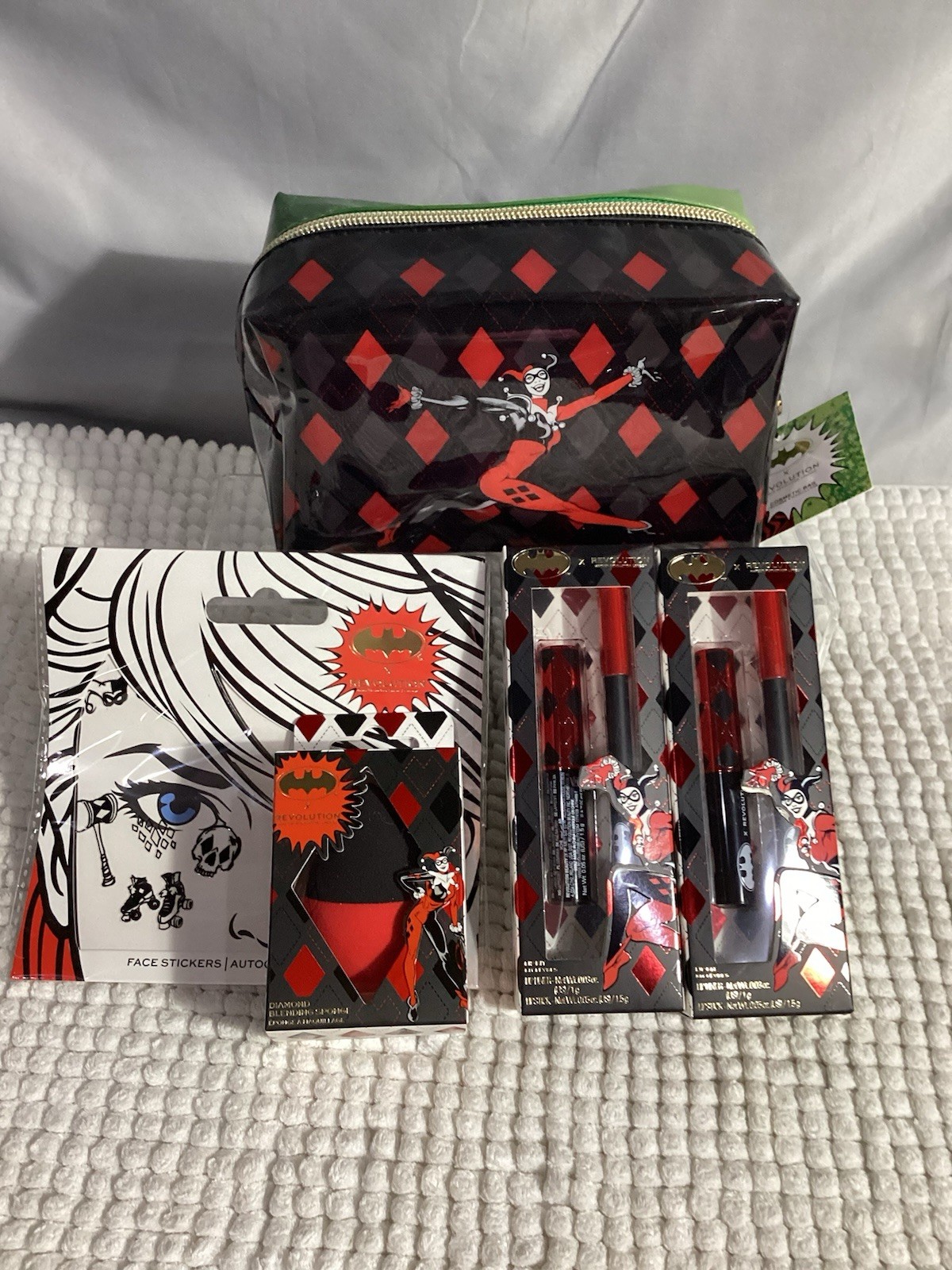 Revolution x DC Harley Quinn 5pc Lot; Cosmetic Bag, Sponge, 2 Lip Kits & Sticker