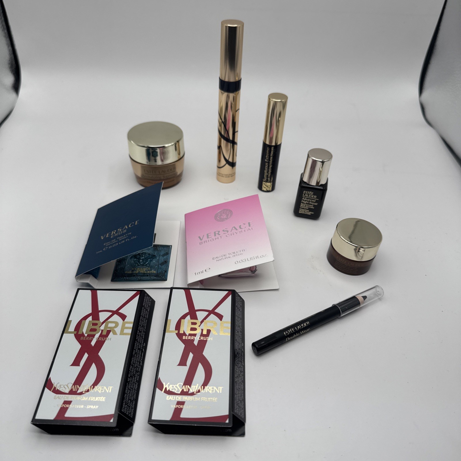 Lot of 10 Assorted Beauty Items/perfume (YSL, Versace, Estēe Lauder)