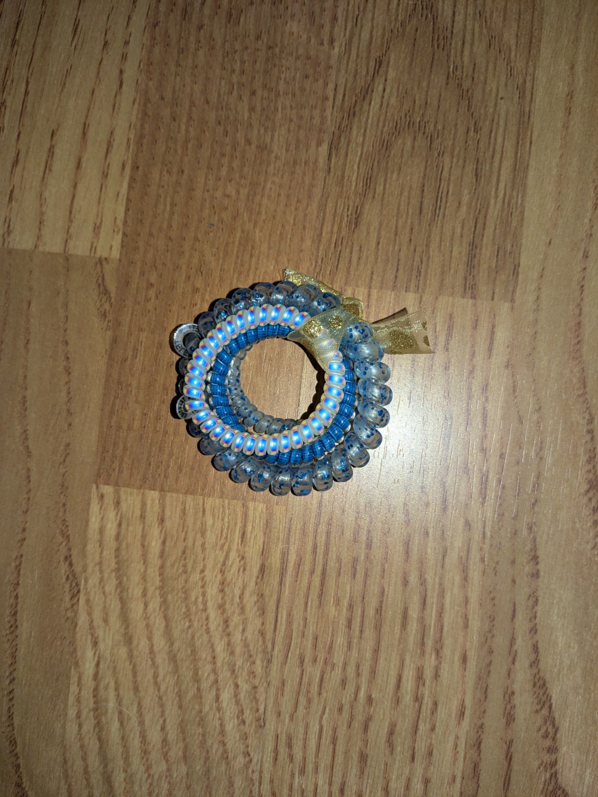 bundle of beauty items: false eyelashes, hair ties, temporary tattoos