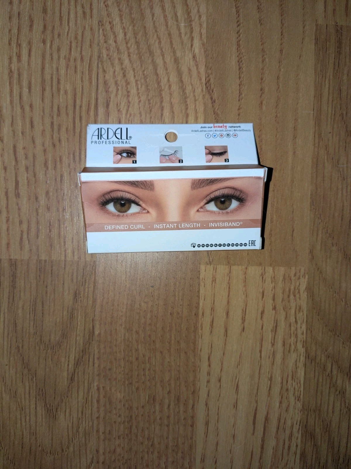 bundle of beauty items: false eyelashes, hair ties, temporary tattoos