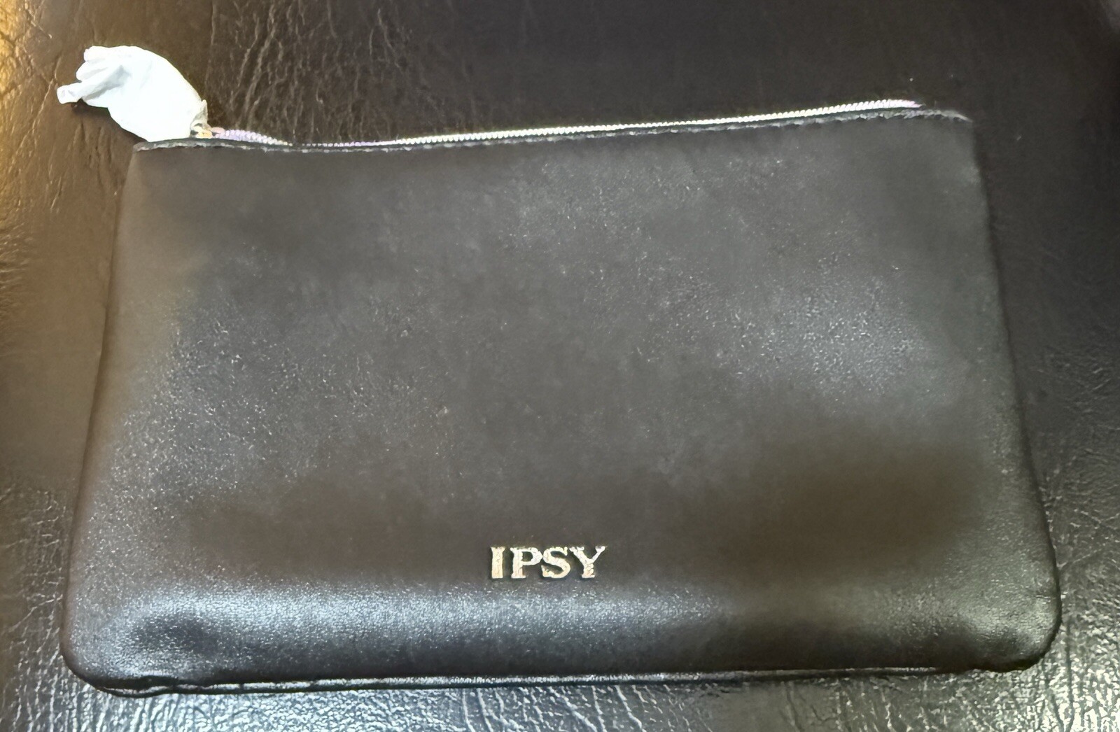 Black Ipsy bag with 5 Sealed sample products