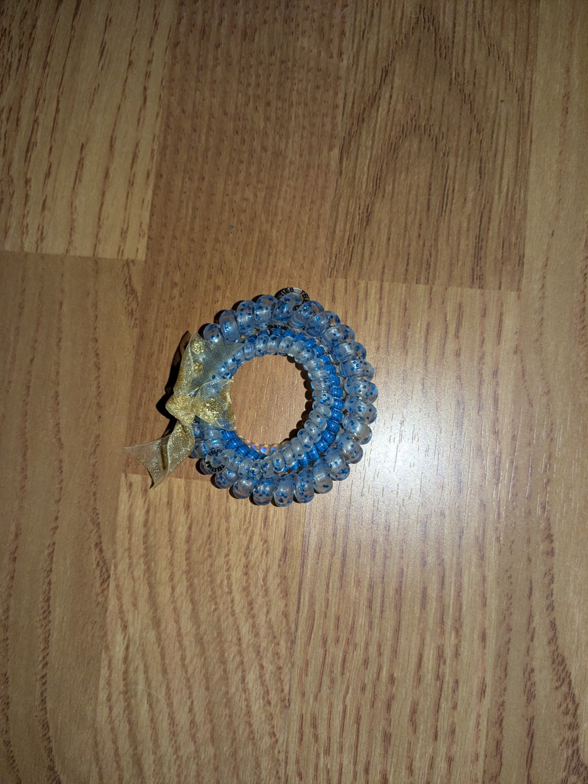 bundle of beauty items: false eyelashes, hair ties, temporary tattoos